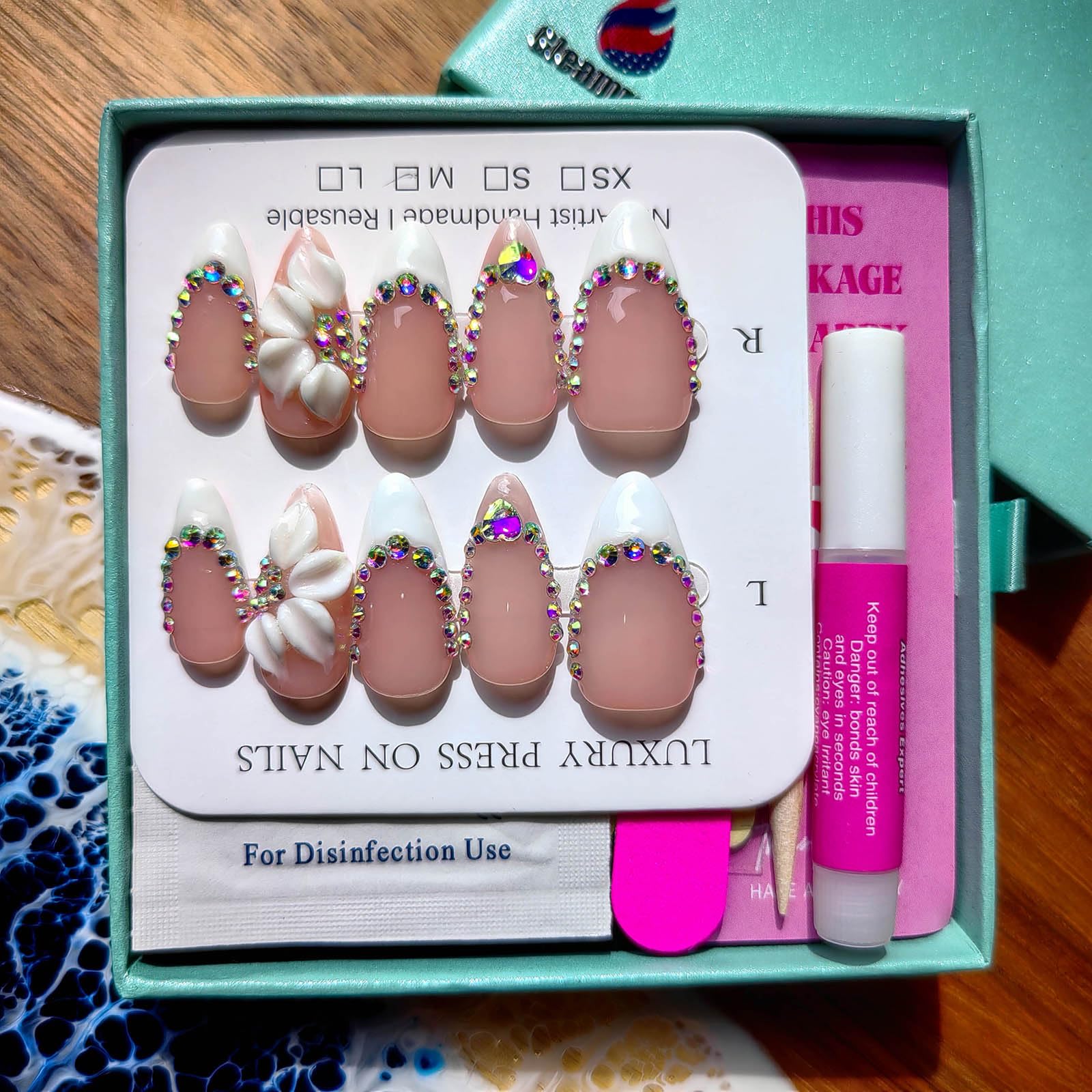 Gleamrain nails showcasing hand-painted designs with intricate artistry on each tip.