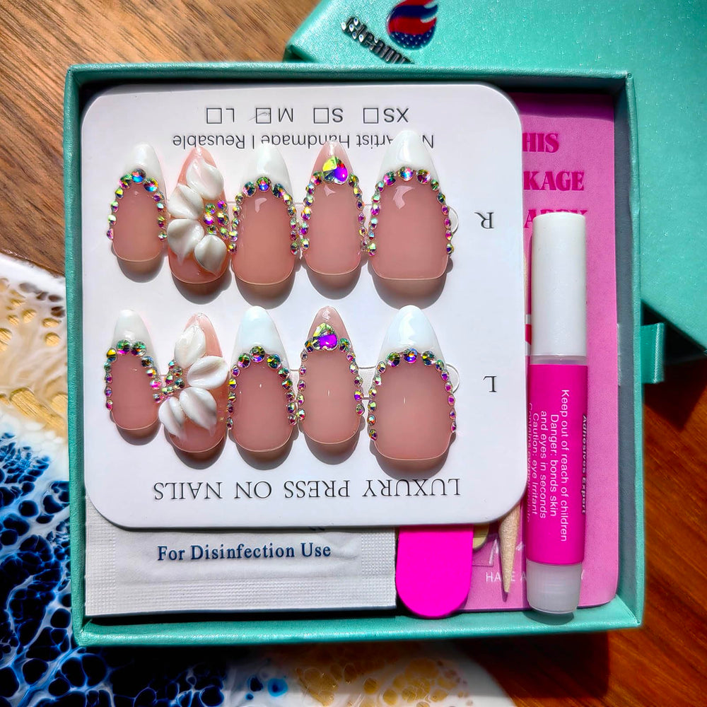 Gleamrain nails showcasing hand-painted designs with intricate artistry on each tip.