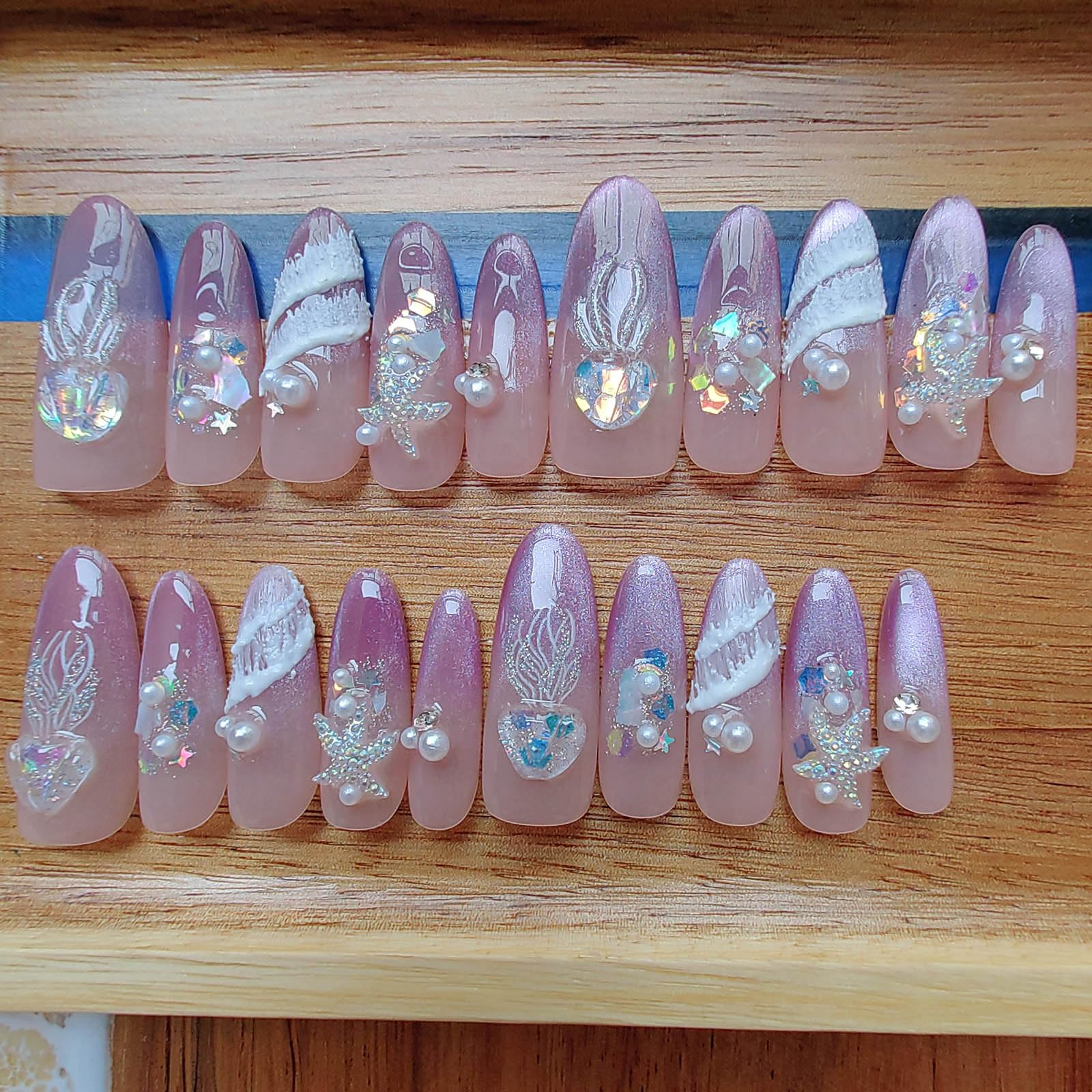 Gleamrain nails feature rhinestones and charms for chic embellishments.