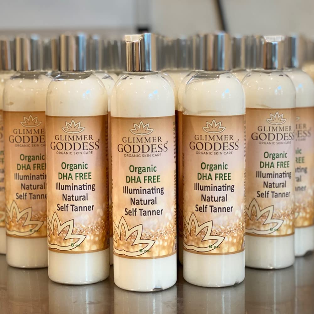 Glimmer Goddess applying self-tanner on arm for even bronze