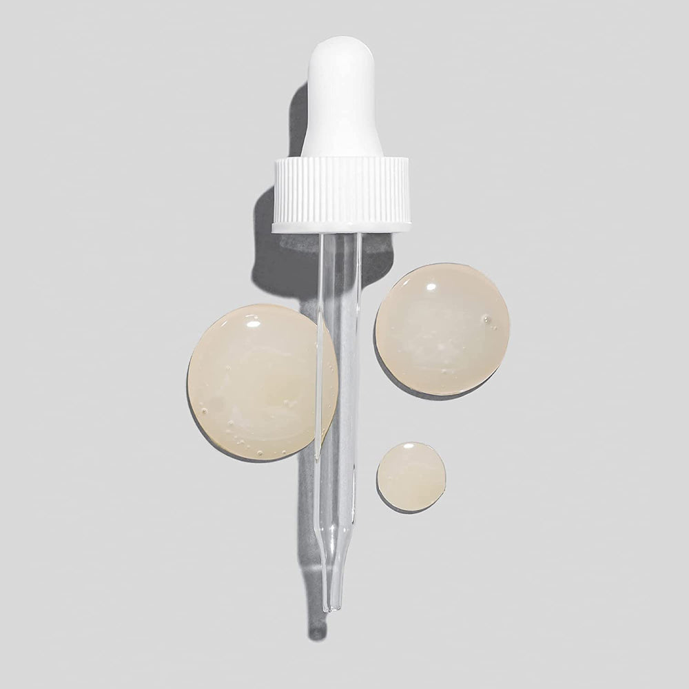 Glo Skin Beauty Hydra-Bright Drops on skin delivering subtle radiance.