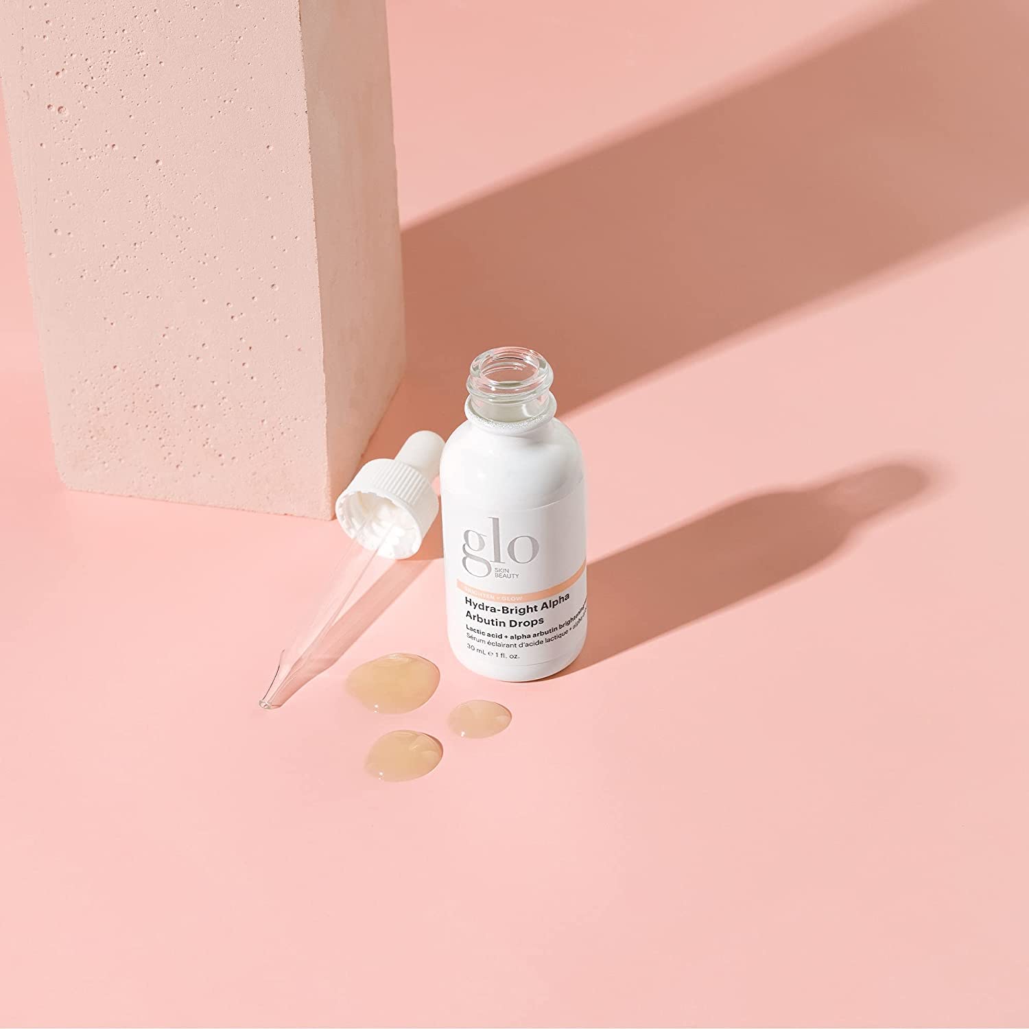 Glo Skin Beauty Hydra-Bright Drops texture close-up showing smooth serum.