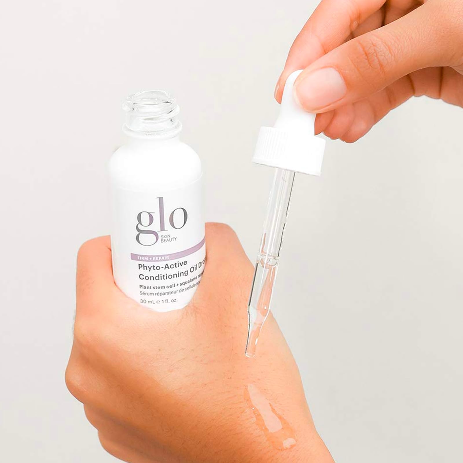 Glo Skin Beauty Phyto-Active Conditioning Oil Drops label close-up highlights stem cell technology.