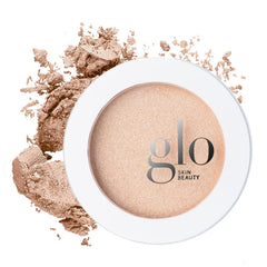 Glo Skin Beauty Skin Glow Powder Highlighter compact swatch shows pearlescent radiance.