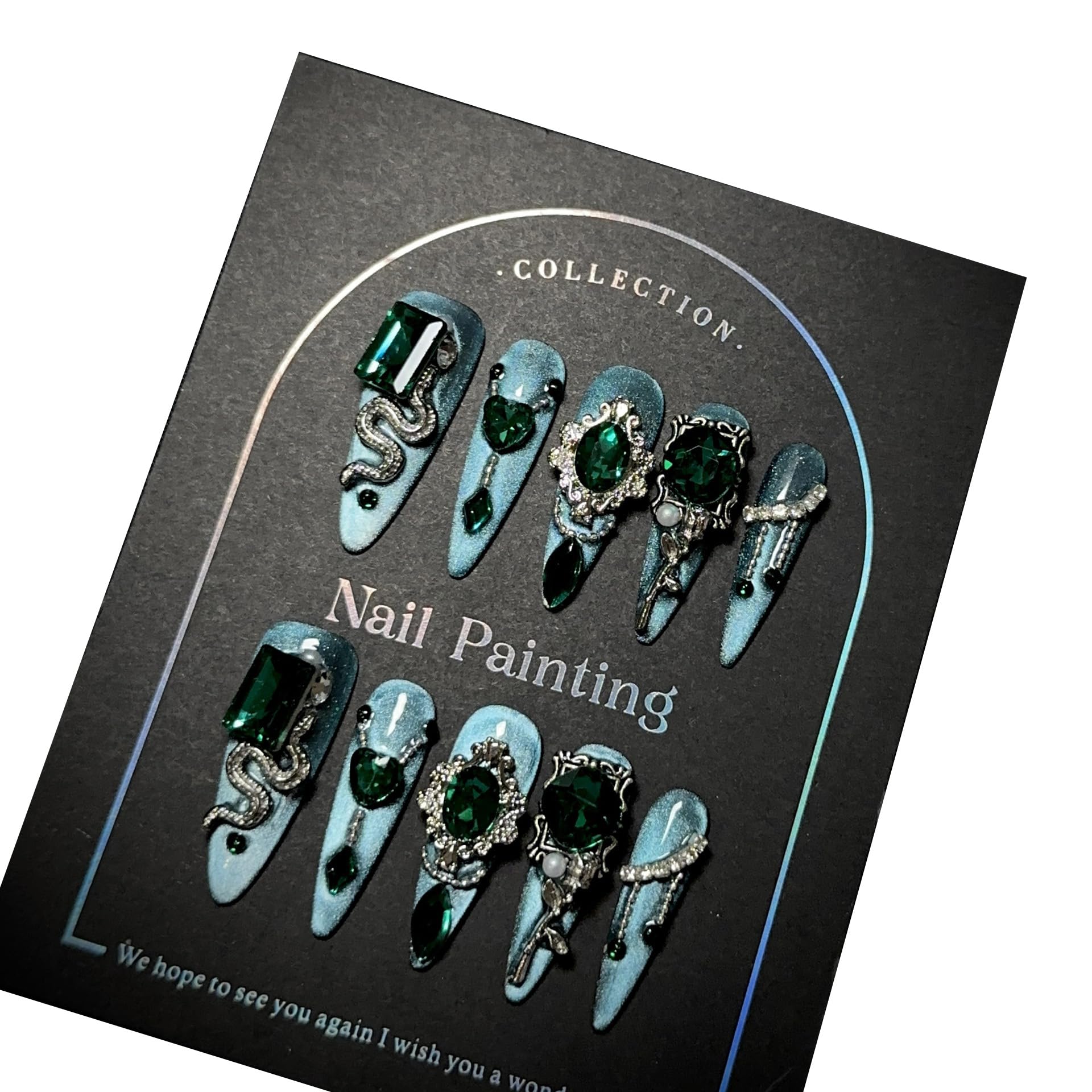 GLORS blue glitter Medusa-inspired long-stiletto nails with rhinestones for dramatic at-home manicure.