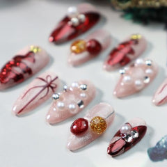 GLORS Christmas nails featuring red bow details for instant party-ready manicure.