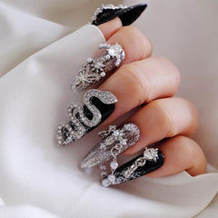 GLORS nails with oversized crystal centerpiece for standout photography moments.