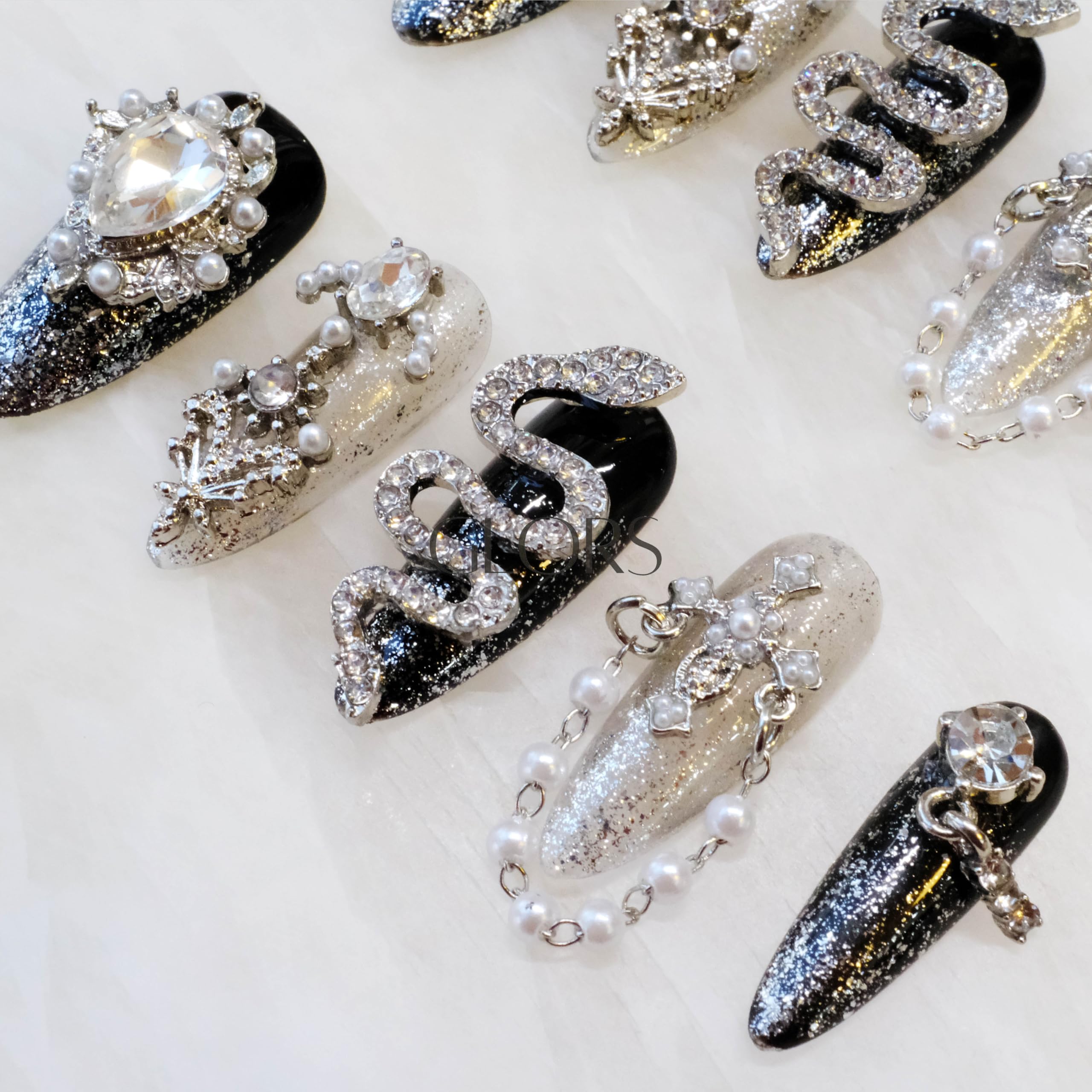 GLORS rhinestone-rich nails sparkle under lights for everyday luxe.