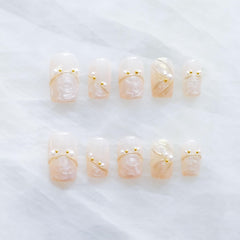 GLORS luxury pearl press-on nails in ballerina medium shape for a sophisticated at-home manicure.