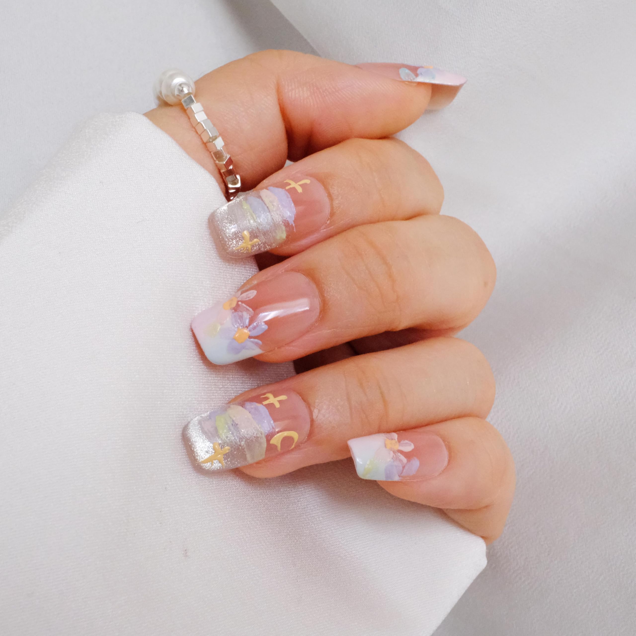 GLORS Purly nails with oil painting flower design on white nude tips for elegant everyday wear.