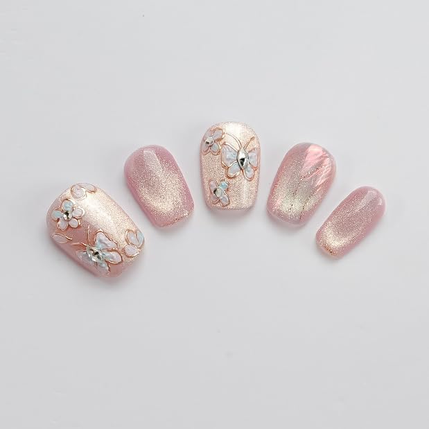 Close-up of hand-painted butterflies enhances GLORS press-on nails' intricate detail.