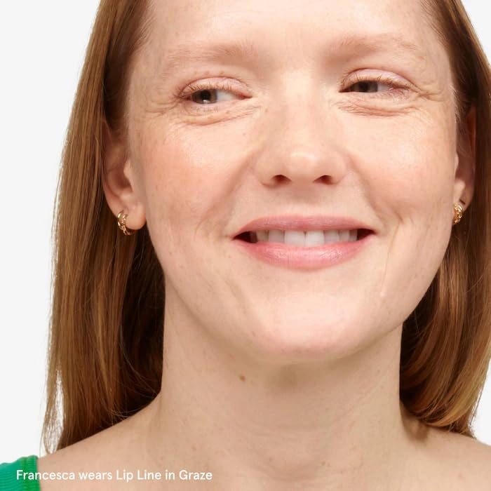 Glossier Graze nude-toned lip liner on skin shows subtle shade.