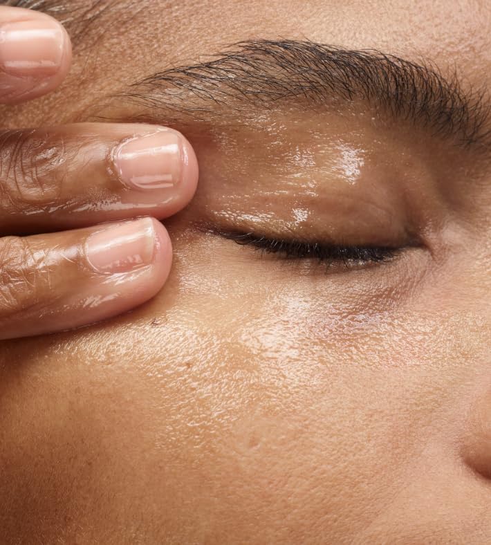 Glossier Milky Oil closeup label shows vegan and cruelty-free formula.