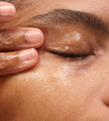 Glossier Milky Oil closeup label shows vegan and cruelty-free formula.