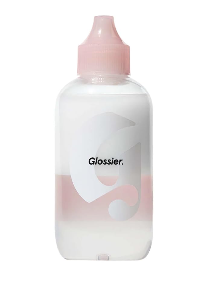 Glossier Milky Oil dual-phase bottle pour shows makeup melting action for easy removal.