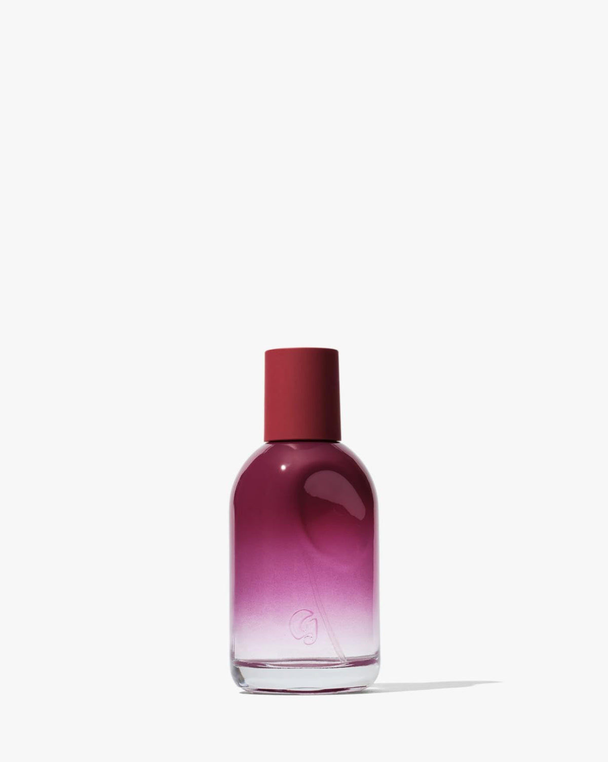 Glossier You Reve bottle with thumbprint indent enhancing a personal, intimate everyday fragrance moment