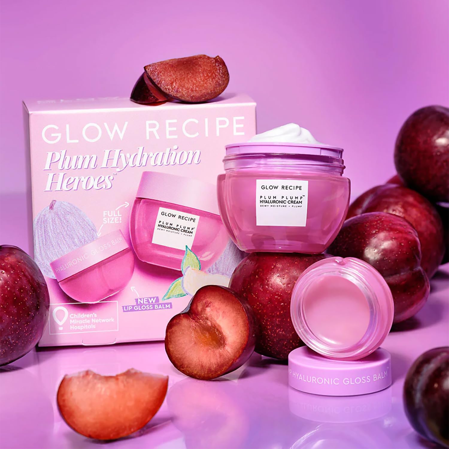 Glow Recipe Plum Plump Hyaluronic Gloss Balm tube on lips for hydration and shine