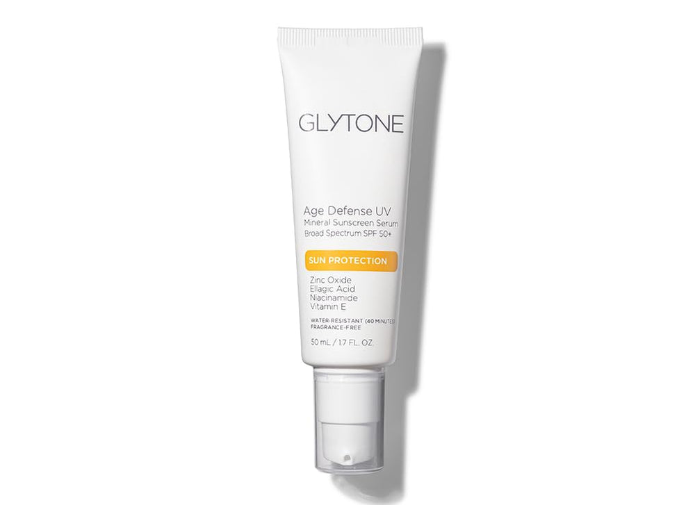 Glytone Age Defense UV Mineral Sunscreen Serum bottle in use, offering daily sun protection