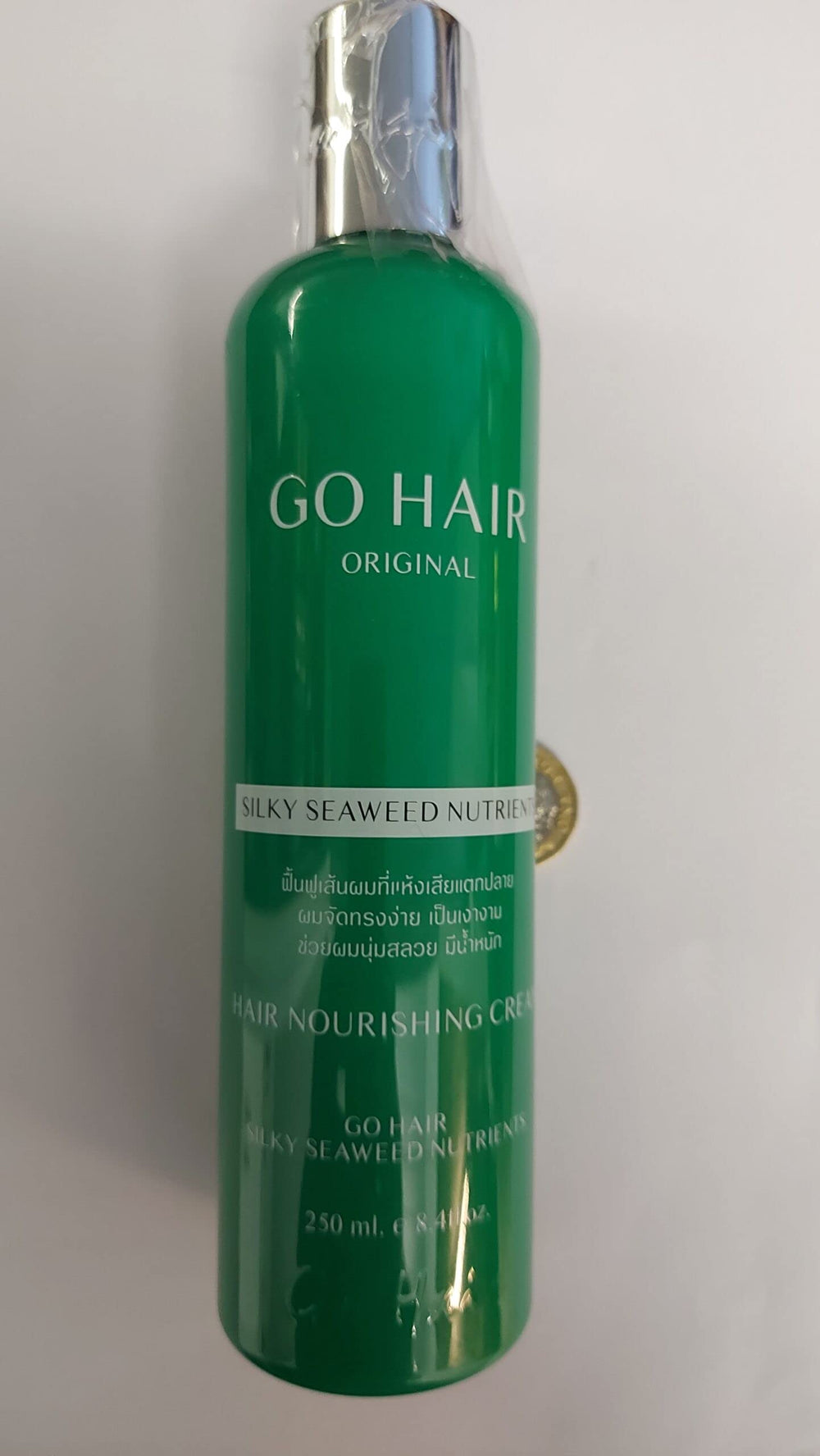 Go Hair Silky Seaweed Nutrients applying to hair ends demonstrates repairing split ends