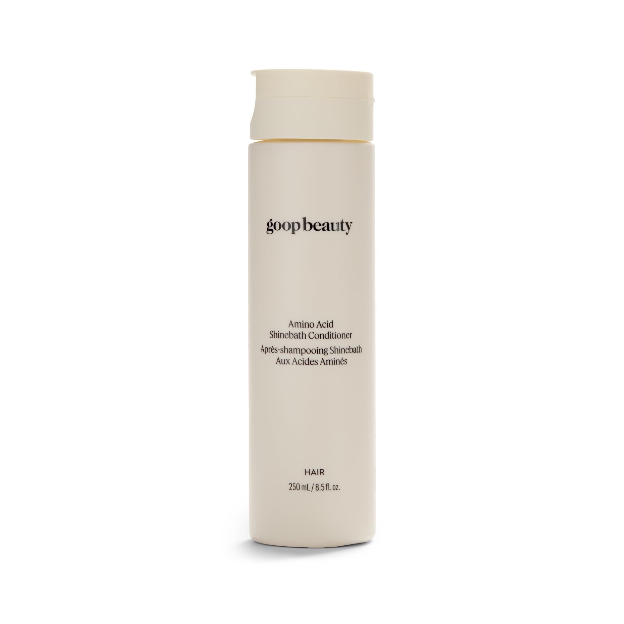 Goop Beauty Amino Acid Conditioner bottle demonstrates detangling-friendly formula.