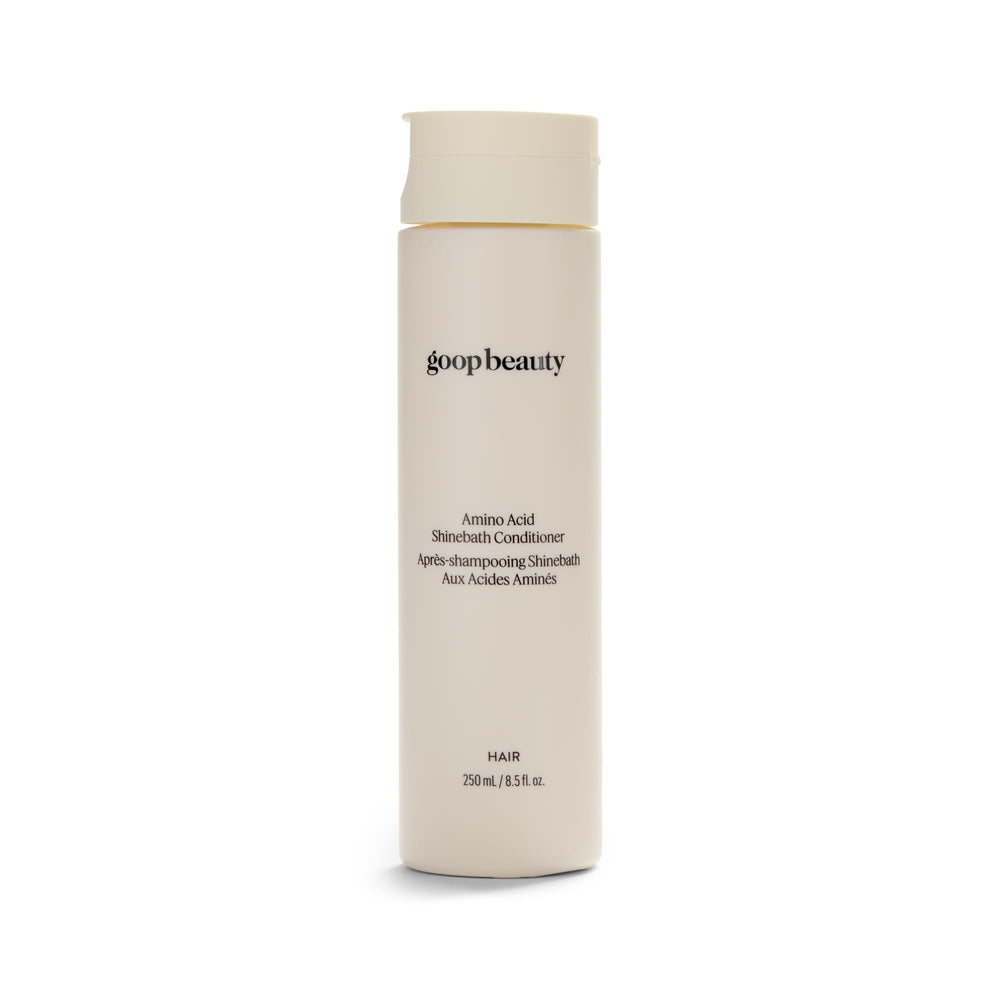 Goop Beauty Amino Acid Conditioner bottle demonstrates detangling-friendly formula.
