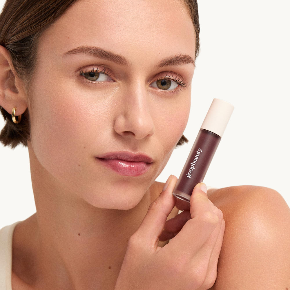 Goop Hydra-Barrier Tulip tube on white backdrop suggests daily lip care ritual.
