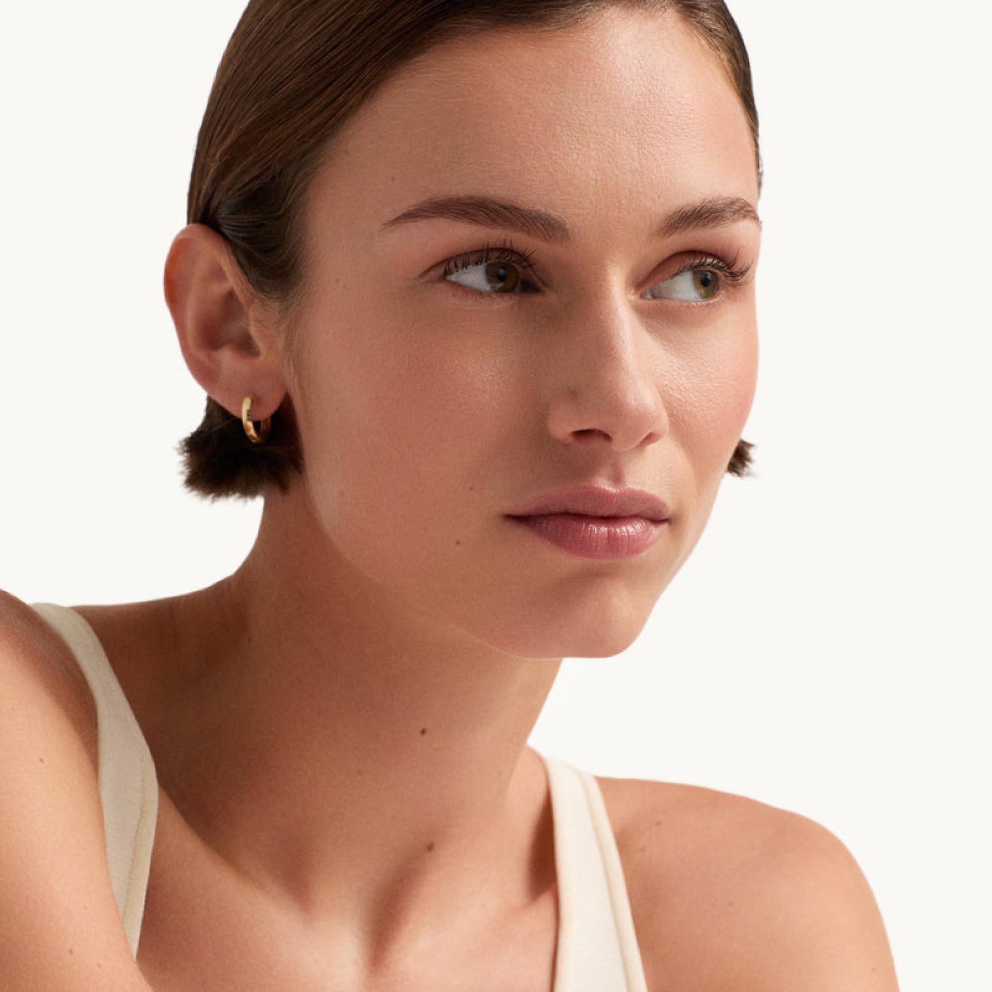 Goop Nourishing Face Cream on vanity signals daily skincare routine.