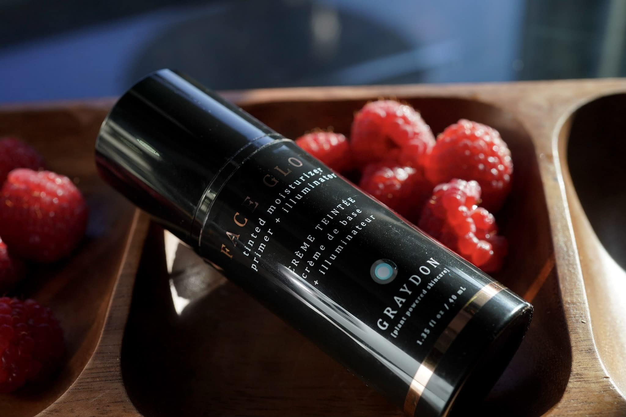 Graydon Face Glow on shoulders and decollete for radiant finish.