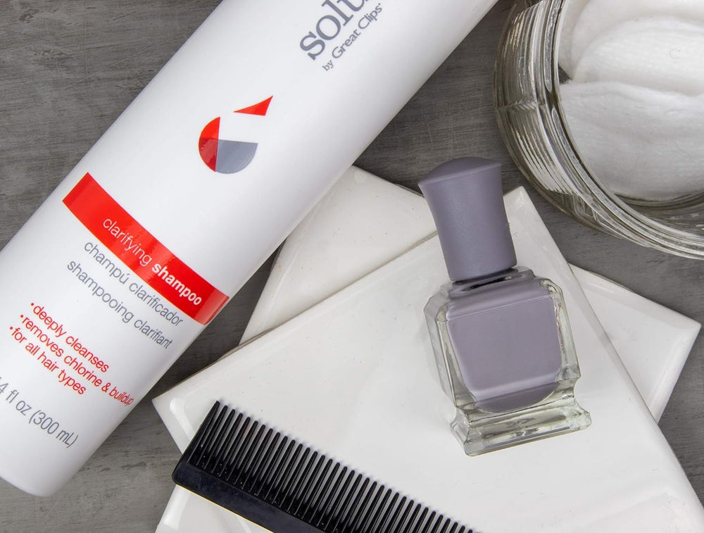 Great Clips Solutions Clarifying Shampoo lather in hand; refreshing cleanse to remove buildup.