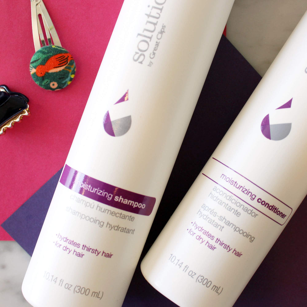 GREAT CLIPS Solutions Moisturizing Conditioner bottle back shows usage and key ingredients.
