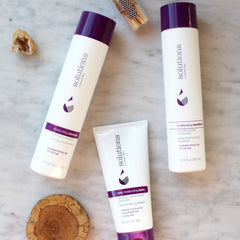 Great Clips Solutions Moisturizing Shampoo pump bottle, demonstrating daily cleansing without drying.