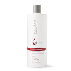 Great Clips Solutions Nourishing Shampoo bottle pour for gentle cleansing and color-safe care.