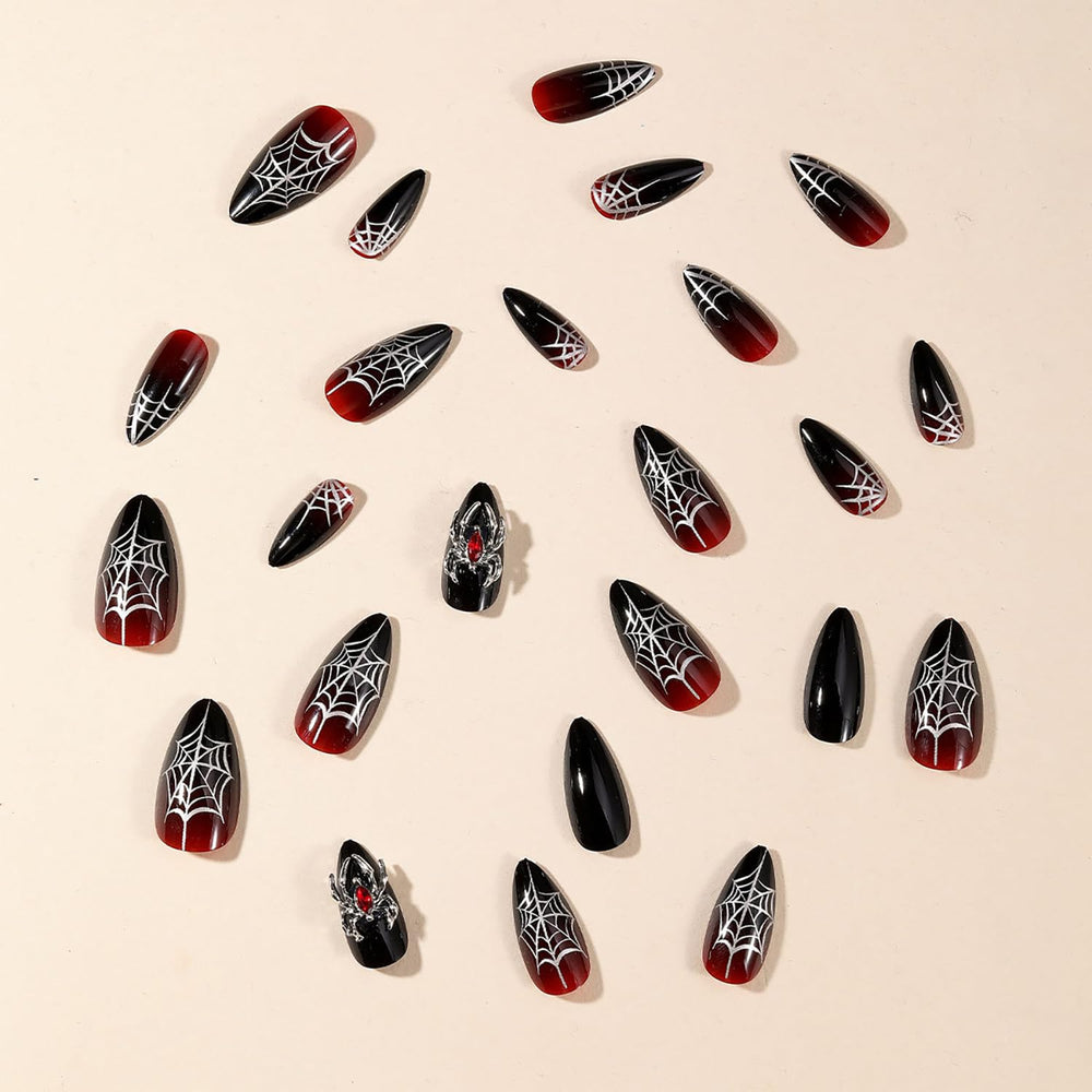 GRITOSE 3D spider accents on luxe black and red nails.