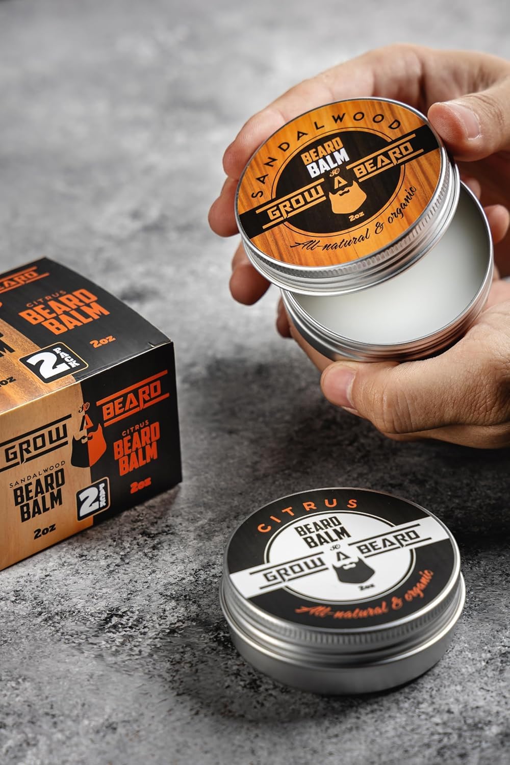 Pack shot showing two 2oz Grow Alpha Beard Balm bottles for daily grooming.