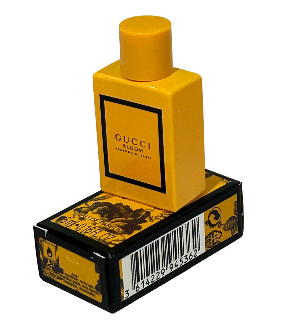 Gucci Bloom mini travel packaging showing compact size for on-the-go fragrance.