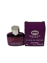 Gucci Guilty Elixir mini bottle cap close-up showing precise dab application.