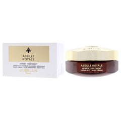 Nighttime routine scene with Guerlain Abeille Royale jar glowing softly.