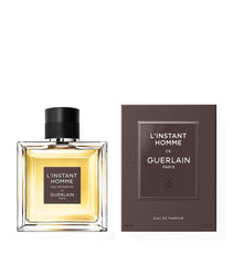 Guerlain L'Instant de Guerlain Pour Homme EDT packaging on shelf, premium men's scent.
