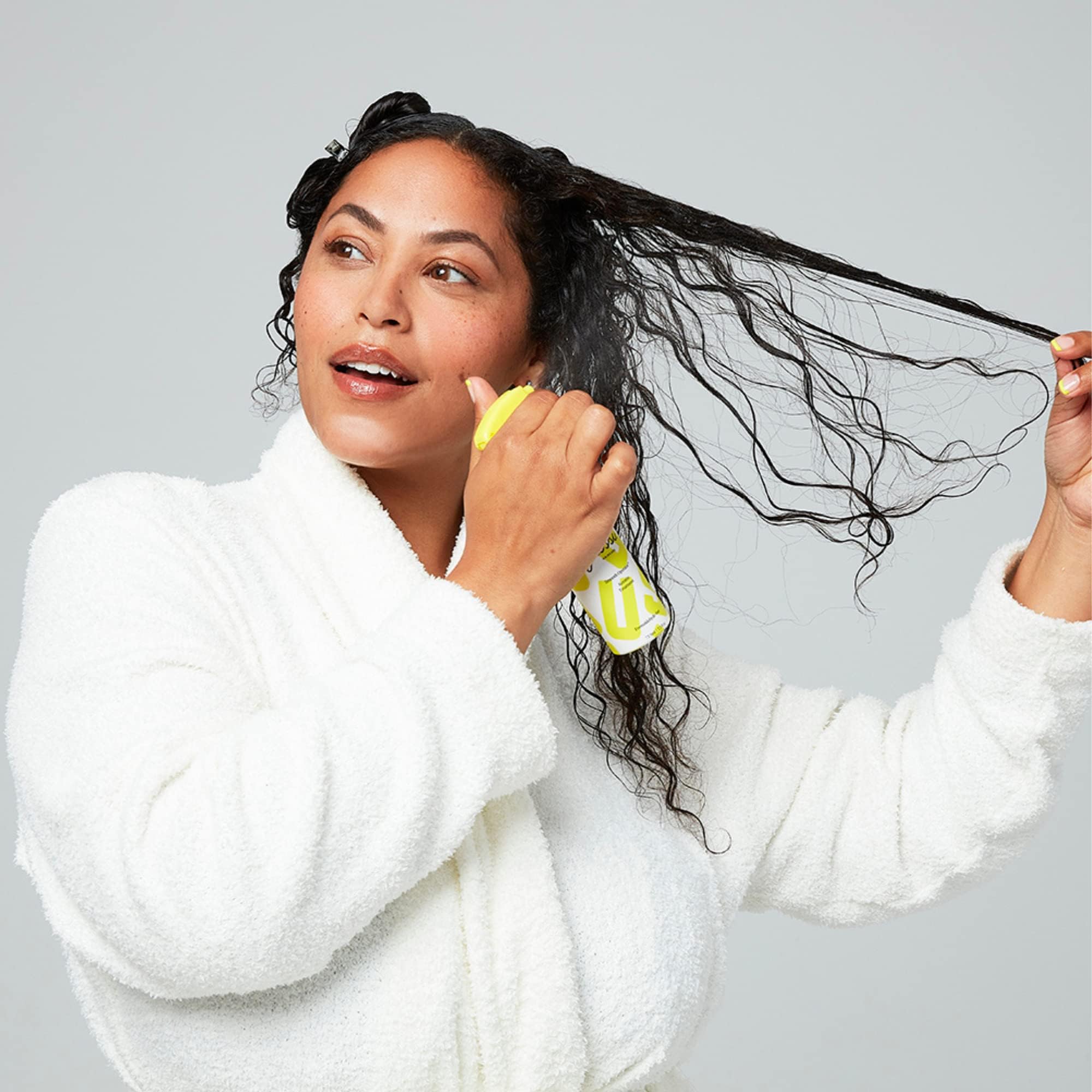 GUSSI HAIRCARE flat iron activation for enhanced shine.