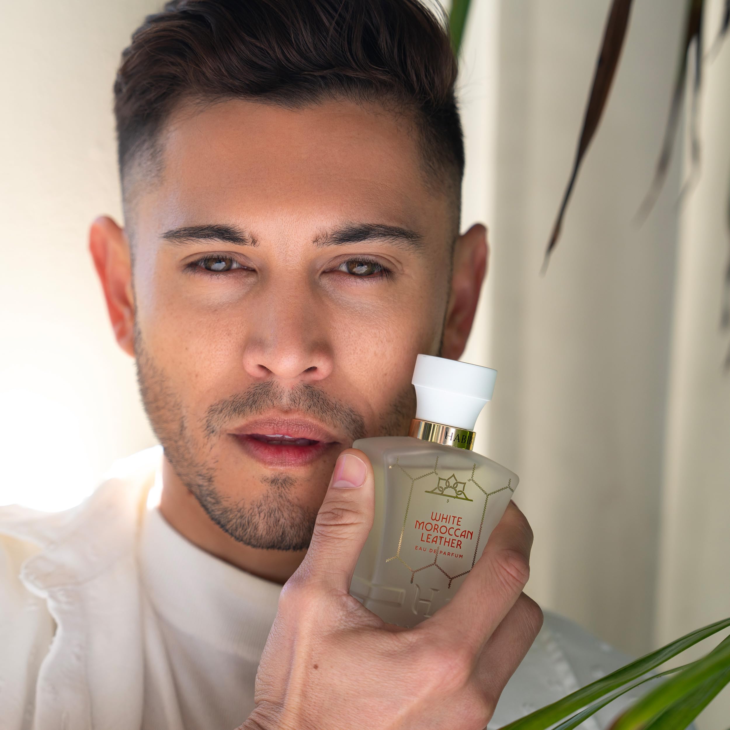 Cap detail on H HABIBI bottle highlights luxury finish.