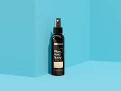 Hair Illusion Fiber Hold Spray in use for fiber adhesion during application.