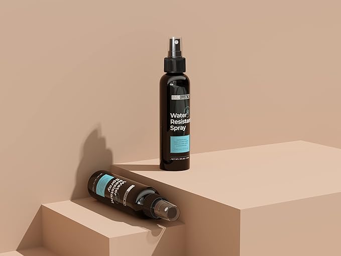 Hair Illusion model applying spray for a refreshed, frizz-free look.