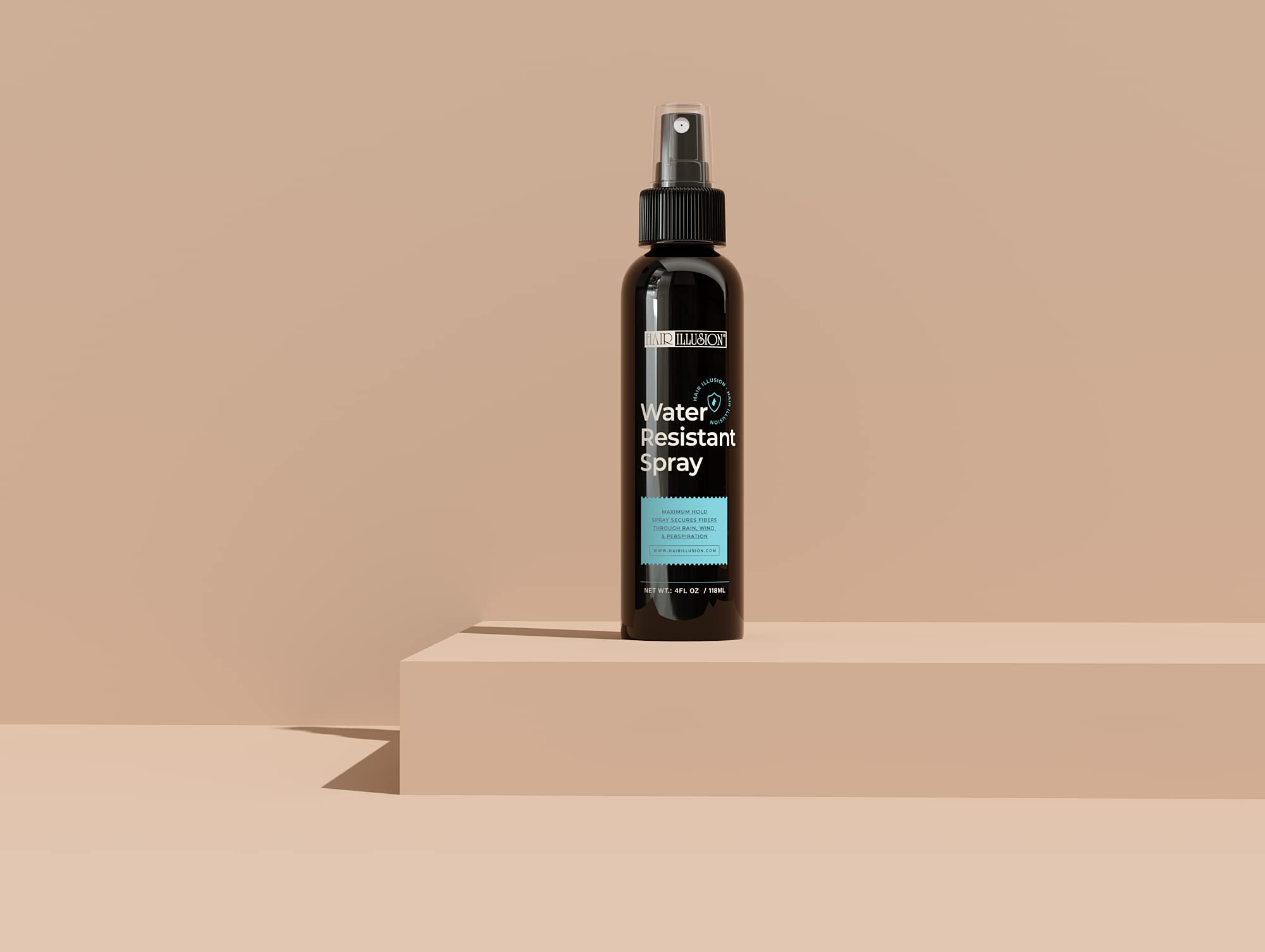 Hair Illusion spray application closeup showing even mist and coverage.