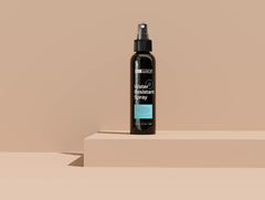 Hair Illusion spray application closeup showing even mist and coverage.