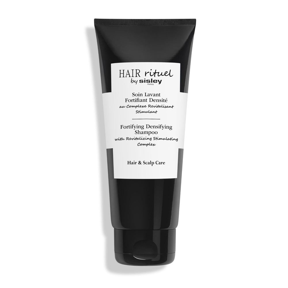 Hair Rituel by Sisley fortifying shampoo bottle demonstrates premium cleansing for fuller-looking hair