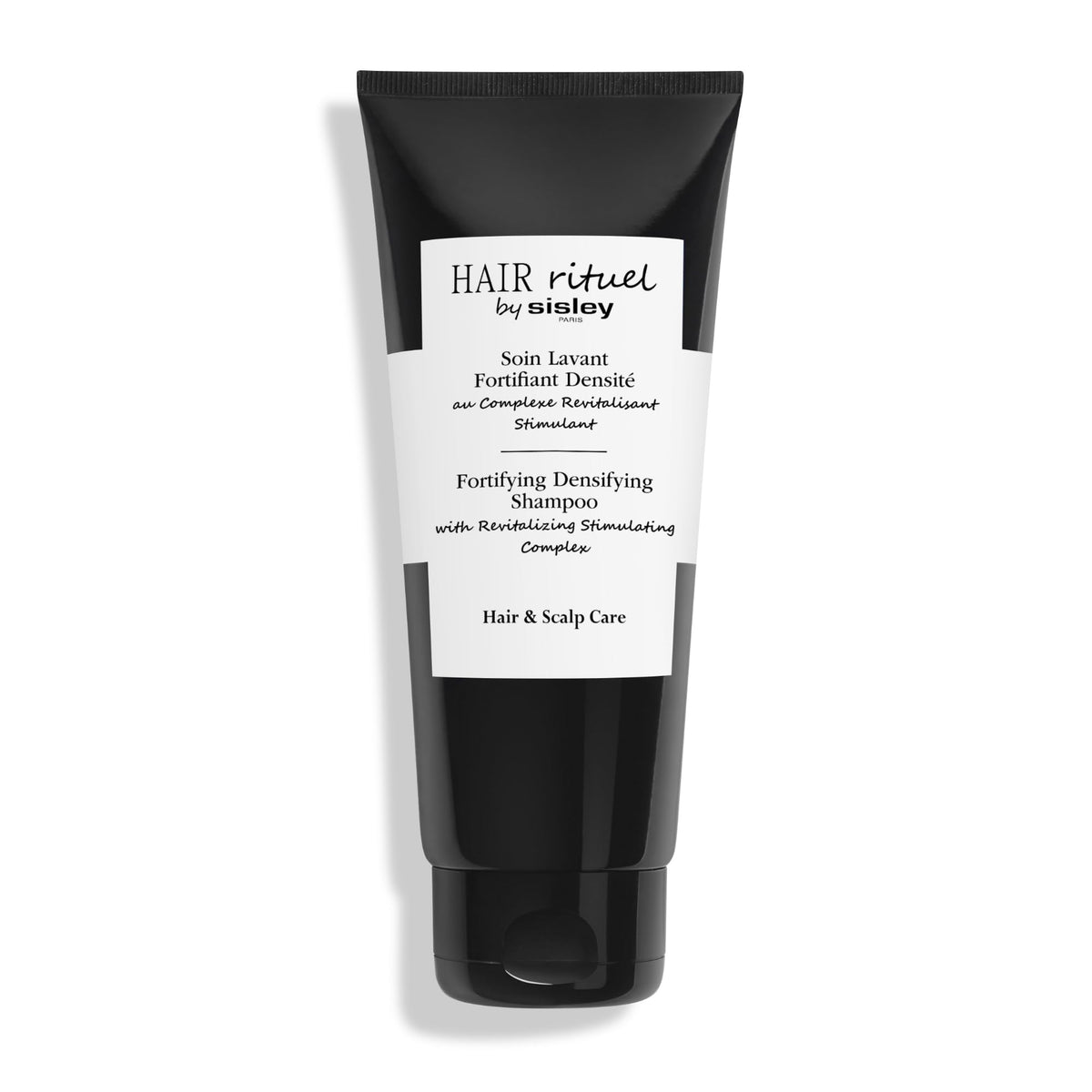 Hair Rituel by Sisley fortifying shampoo bottle demonstrates premium cleansing for fuller-looking hair