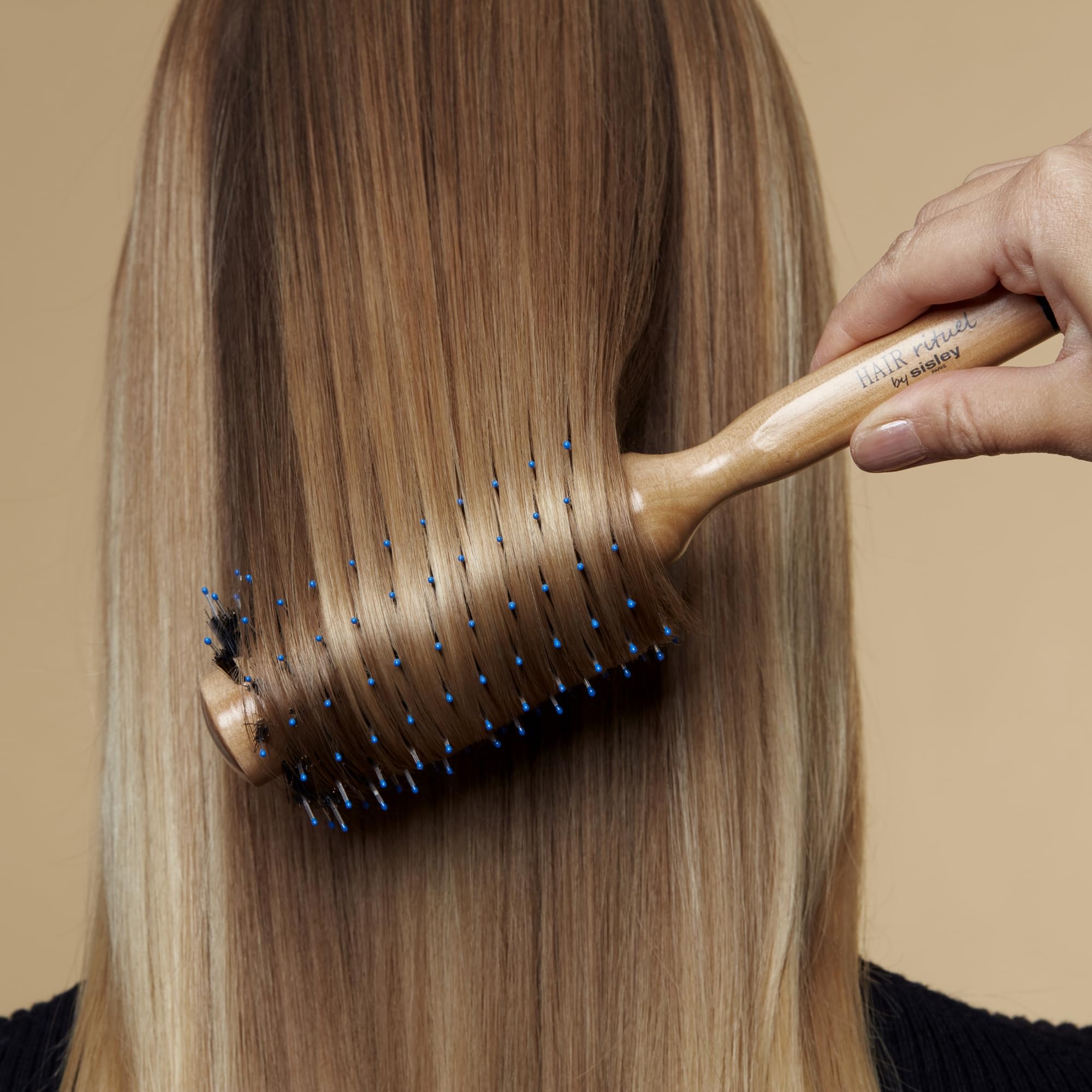 Hair Rituel by Sisley boosts root volume during blow-drying.