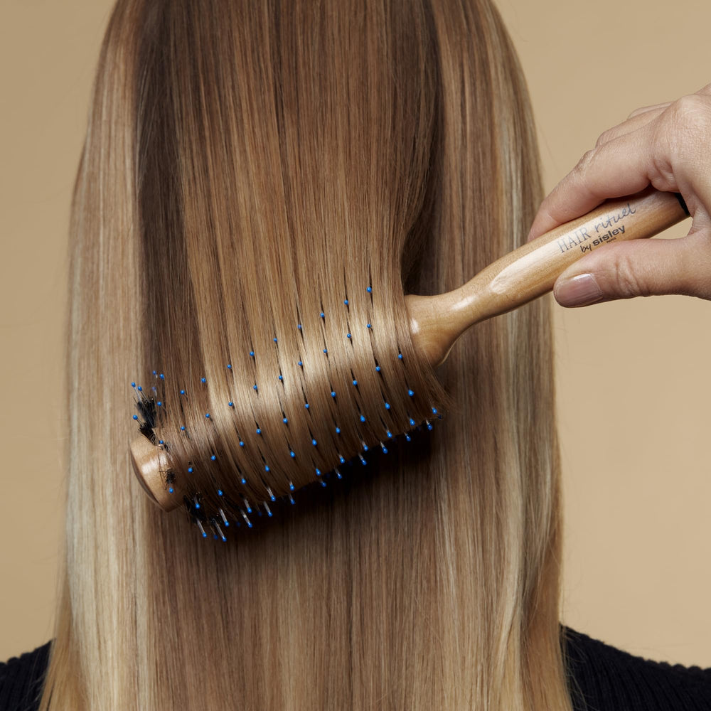 Hair Rituel by Sisley boosts root volume during blow-drying.