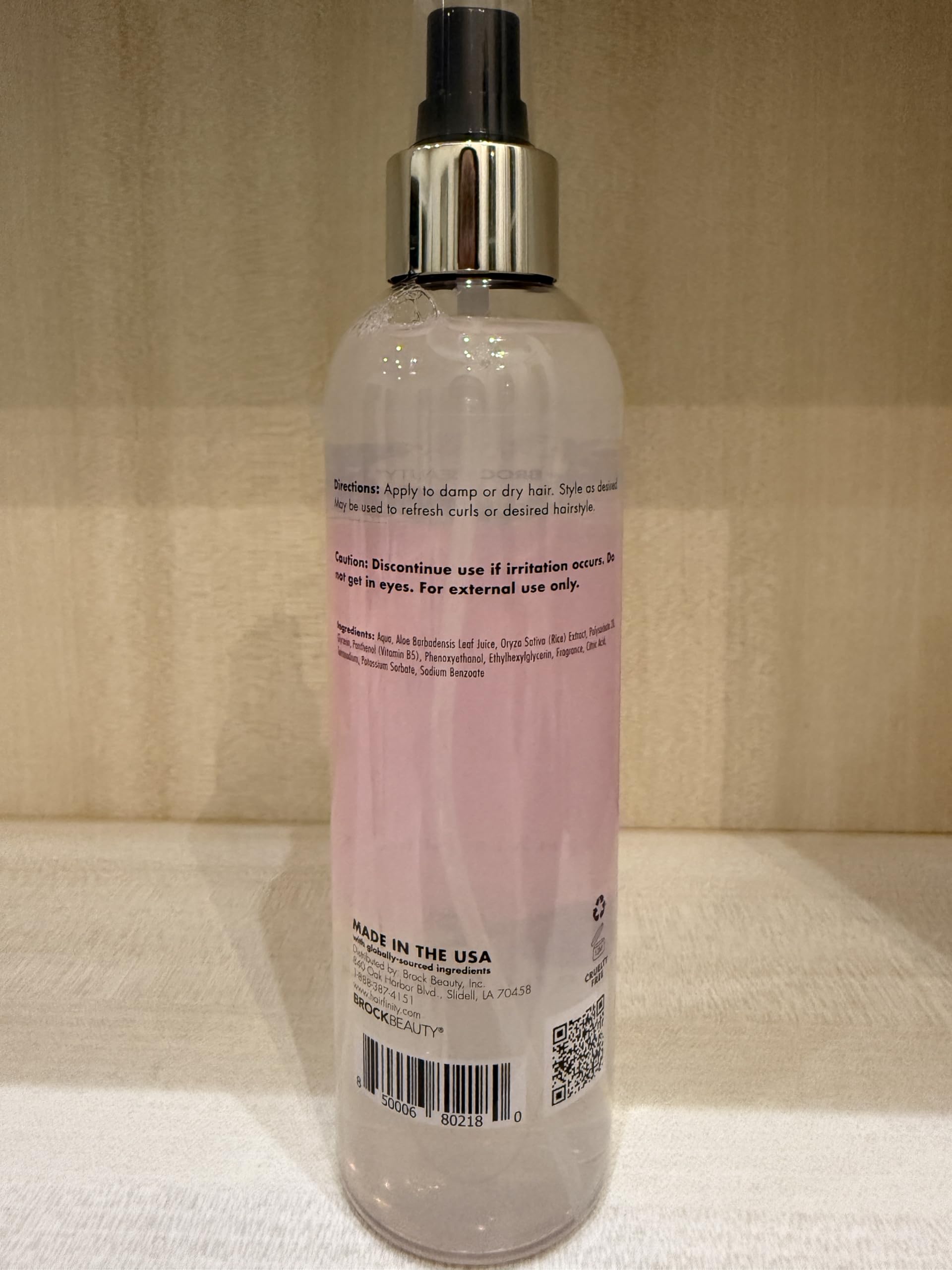 Hairfinity Rice Water Hair Mist on glossy hair after use for shine.