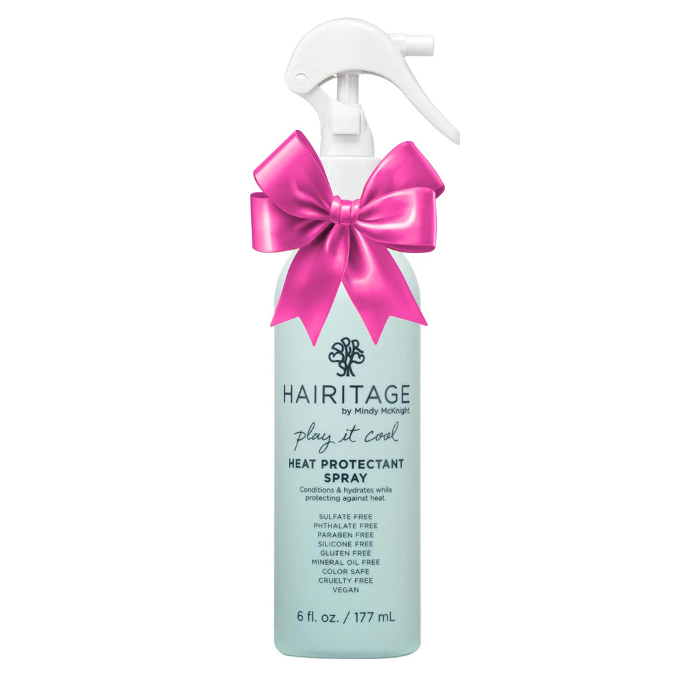 Hairitage heat protectant spray bottle shown for protection during heat styling